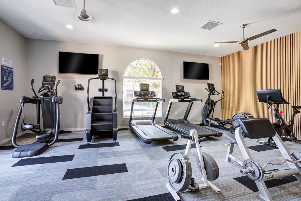 the gym has cardio equipment and treadmills in it